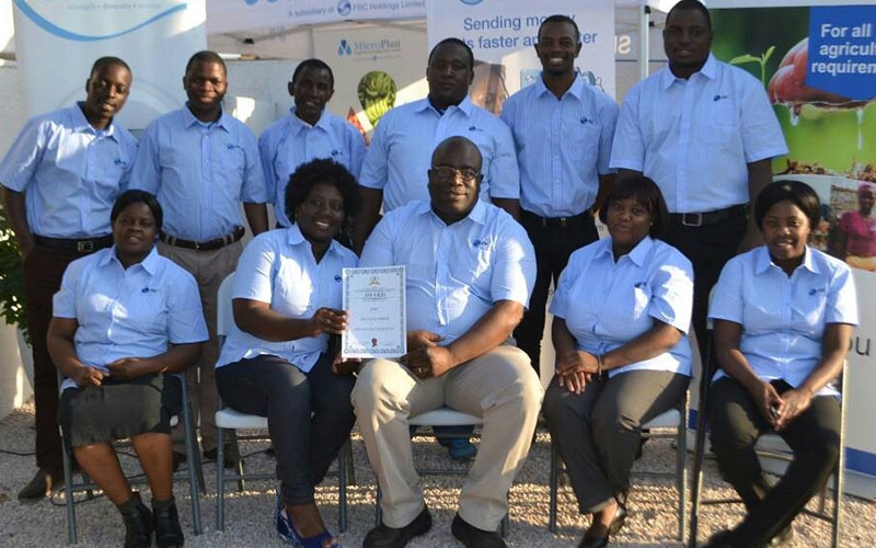 FBC Bank Chinhoyi Branch team poses for a photo at the award winning FBC MashWest Agricultural Show Stand